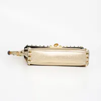 Valentino Garavani Rockstud Dourada - imagem 7